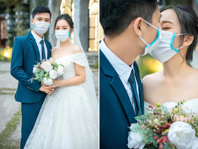 Giữa tâm dịch Corona, cặp đôi Việt đeo kín khẩu trang chụp ảnh cưới