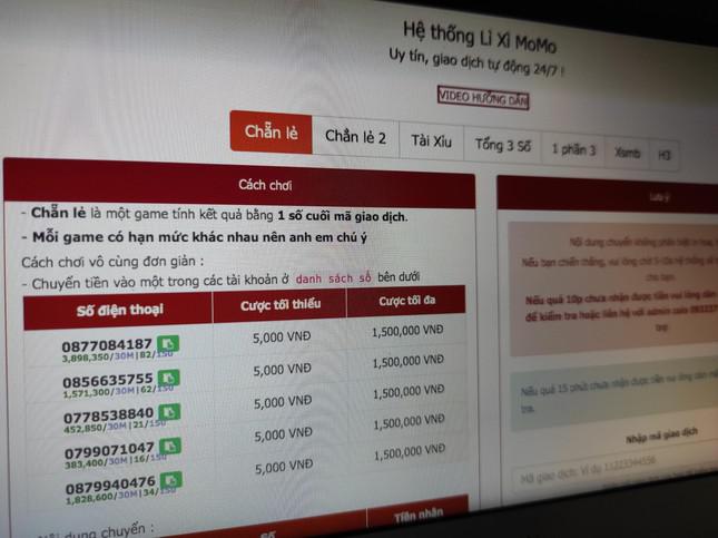 Giao diện một trang web cờ bạc hướng dẫn đánh bạc trên ví điện tử MoMo.