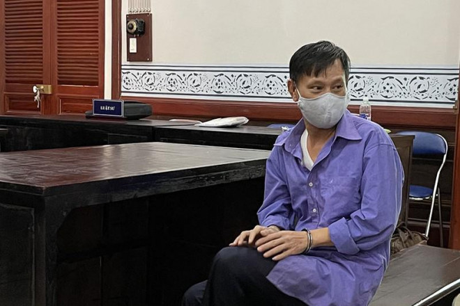 Phạm Quang Tiến tại phiên xử sơ thẩm lần một. Ảnh: H.YẾN
