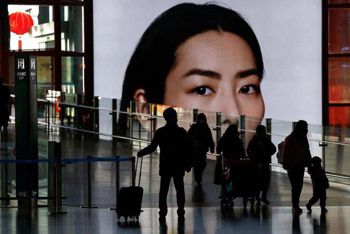 Hành khách tại tại Sân bay Quốc tế Thủ đô Bắc Kinh - Trung Quốc vào tháng 1-2023, dịp cao điểm Tết Nguyên Đán - Ảnh: REUTERS