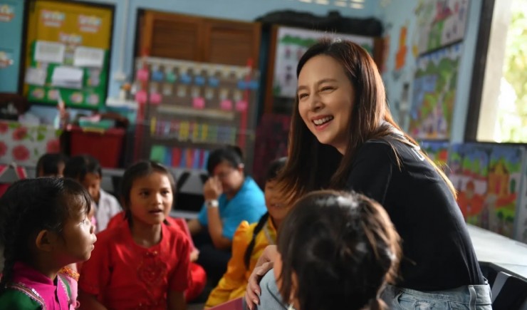 Madam Pang cũng tích cực tham gia các hoạt động thiện nguyện. Ảnh: UNICEF