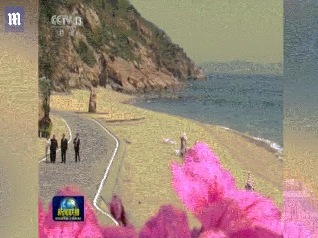 Kim Jong-un bất ngờ xuất hiện ở TQ, đi dạo bờ biển với Tập Cận Bình
