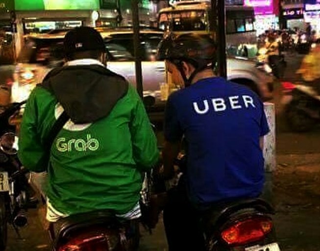 Grab liệu có buộc phải &#39;ly hôn&#39; với Uber tại Việt Nam? - 1
