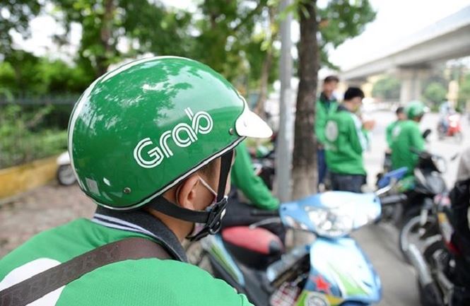 Grab bị tố tăng giá cước sau khi thâu tóm Uber - 2