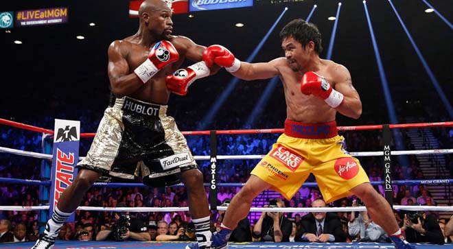 Mayweather (trái) không có tinh thần cống hiến như Pacquiao