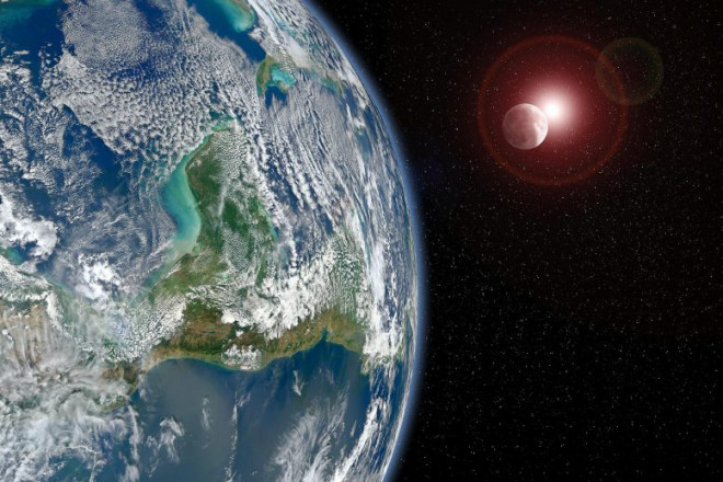 Ảnh đồ họa mô tả "trái đất trong gương" và một mặt trời đỏ - ảnh: SCI-TECH DAILY