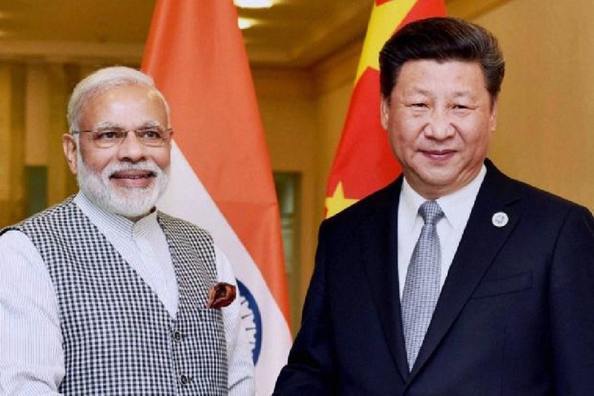 Thủ tướng Ấn Độ Narendra Modi (trái) và Chủ tịch Trung Quốc Tập Cận Bình chưa tìm ra được "tiếng nói chung" trong vấn đề tranh chấp biên giới Trung - Ấn. Ảnh: PTI
