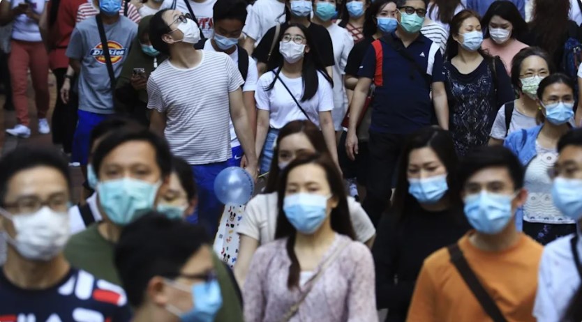 Theo một nghiên cứu mới, hơn 2 vạn người Hong Kong, Trung Quốc, có thể đang mang mầm bệnh Covid-19 nhưng không biểu hiện triệu chứng. Ảnh: May Tse