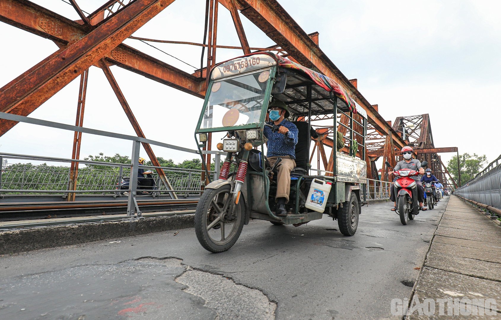 Long Bien Bridge is rusted, entangled with potholes, patched here and there - 13