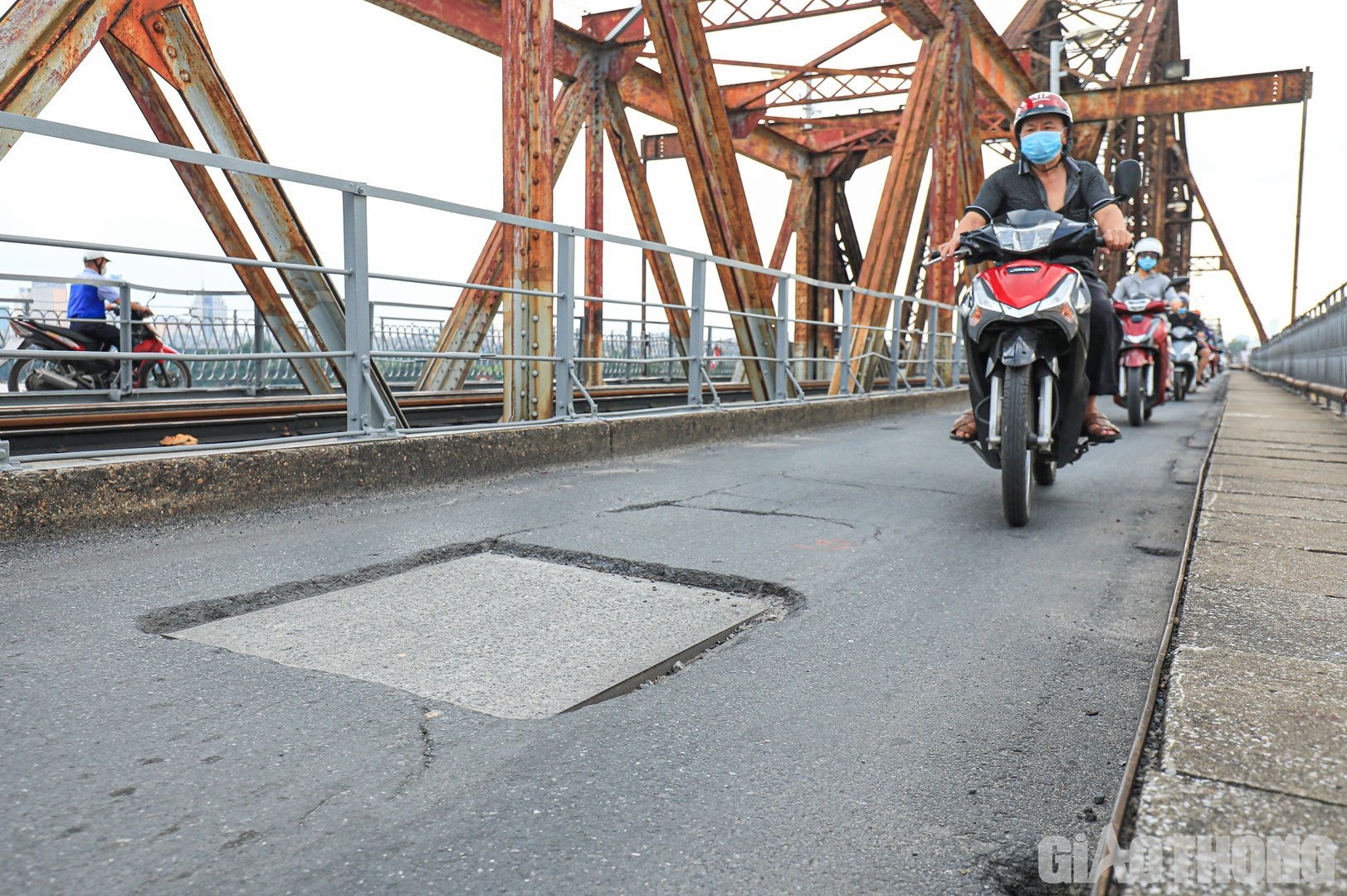 Long Bien Bridge rusted, entangled with potholes, patched here and there - 6