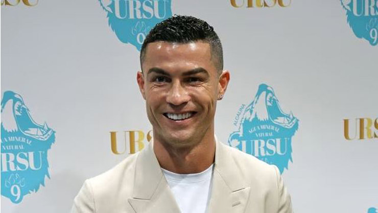 Ronaldo wore a youthful white suit when presenting his new business project about a mineral water brand at the Pestana CR7 hotel in Madrid on June 7.