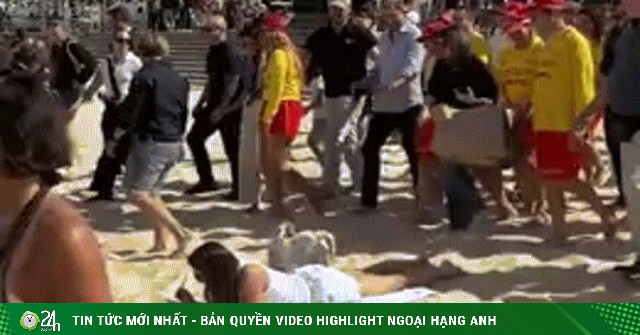 Cô gái tắm nắng trên bãi biển gây sốt vì phớt lờ Harry - Meghan