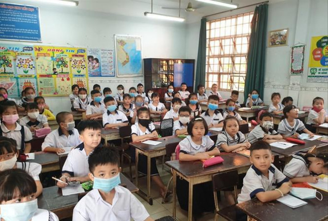 Học sinh Trường Tiểu học Lê Văn Thọ, quận 12, TPHCM trong buổi tựu trường ngày 1/9