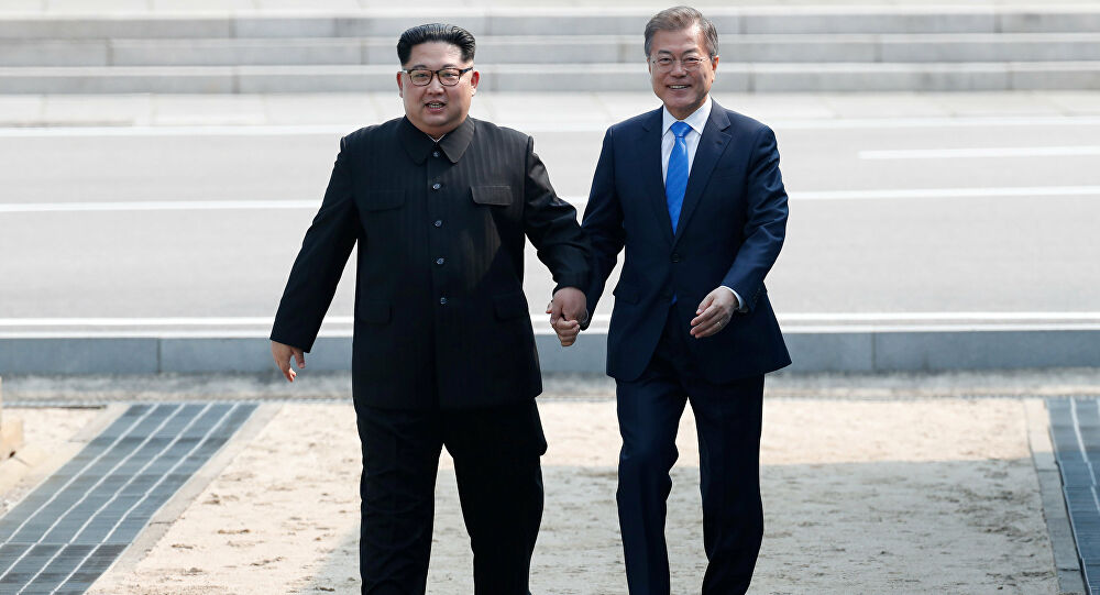 Ông Moon Jae In và ông Kim trong một cuộc gặp (ảnh: Yonhap)