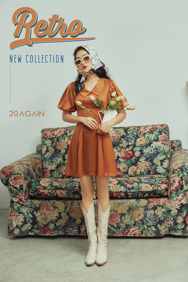 Vẫn là màu sắc chủ đạo của retro như vàng gụ, đỏ cam và nâu đất…, chiếc váy xoè tay bồng cùng khăn turban trắng biến outfit trở nên “hợp thời” và “sang chảnh". Thiết kế tinh tế, gam màu “xưa cũ” nhuộm vàng cả bầu trời thu.
