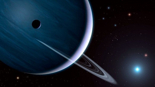 Ảnh đồ họa mô tả một "gia đình quái vật" với một ngôi sao xanh lam và một hành tinh khí khổng lồ, cả hai đều rất lớn và rất mạnh mẽ - Ảnh: TRƯỜNG ĐẠI HỌC SHEFFIELD