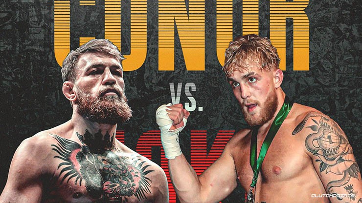 McGregor (trái) và Jake Paul đấu khẩu