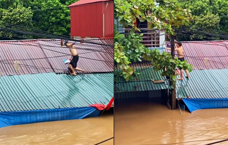 Sau đó, anh cẩn trọng đi trên mái nhà trơn trượt để đem thực phẩm đến hỗ trợ người cần. Ảnh: Cắt từ clip