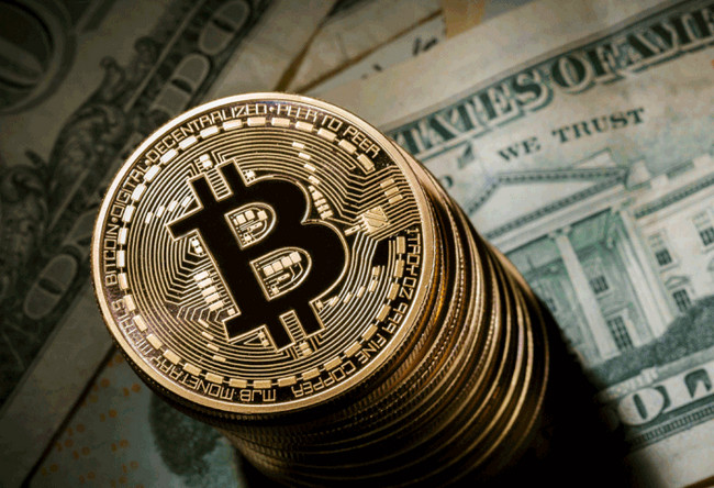 Tiền điện tử Bitcoin đã vượt mốc 20.000 USD và đang hướng tới những cột mốc ấn tượng mới - Ảnh Reuters