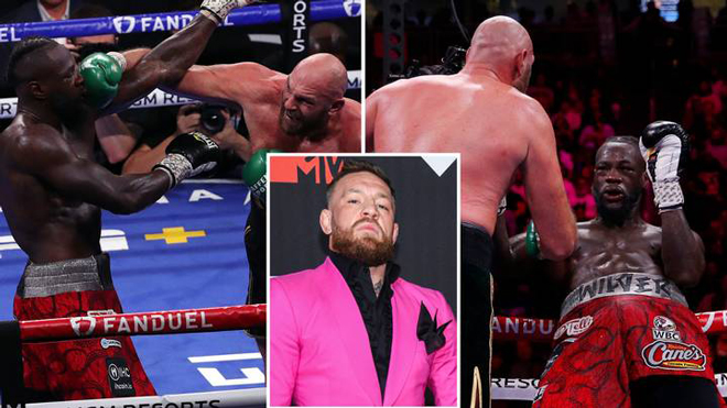McGregor (giữa) tin rằng nếu hai võ sĩ bằng cân nhau, Wilder có thể đã thắng