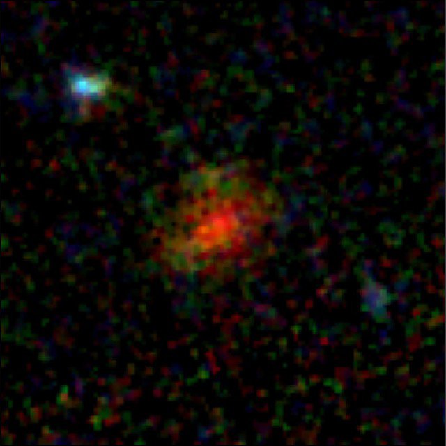 Vật thể ma quái được xác định là một thiên hà hình thành sao đầy bụi cổ đại - Ảnh: NASA/ESA/CSA