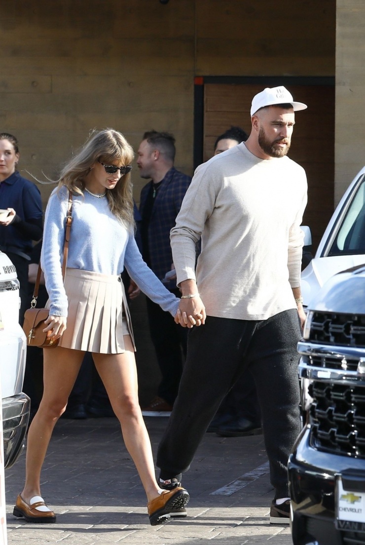 In March, the Fortnight singer went out in a preppy style, including a pleated mini skirt, loafers, and a solid sweater. Travis Kelce wore a monochrome outfit that matched his girlfriend's. Photo: Backgrid